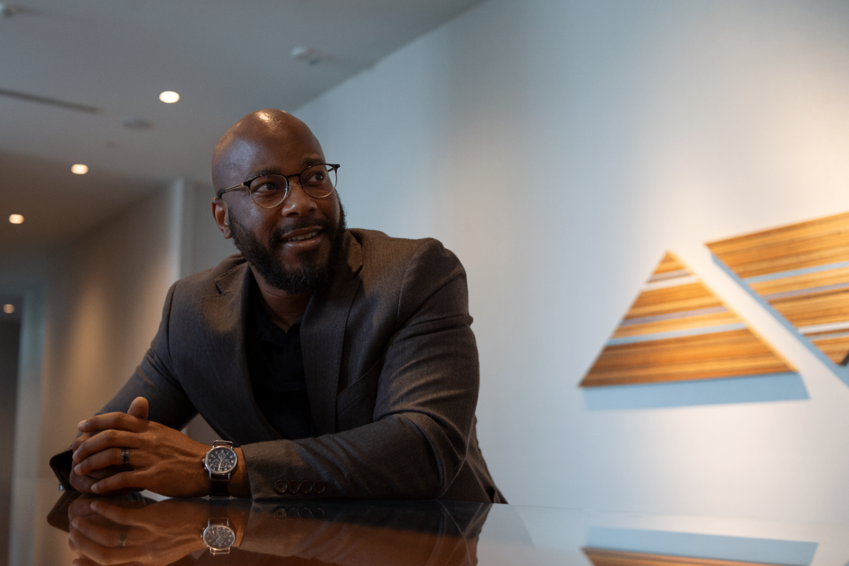 Founder leaning across the table during a conversation