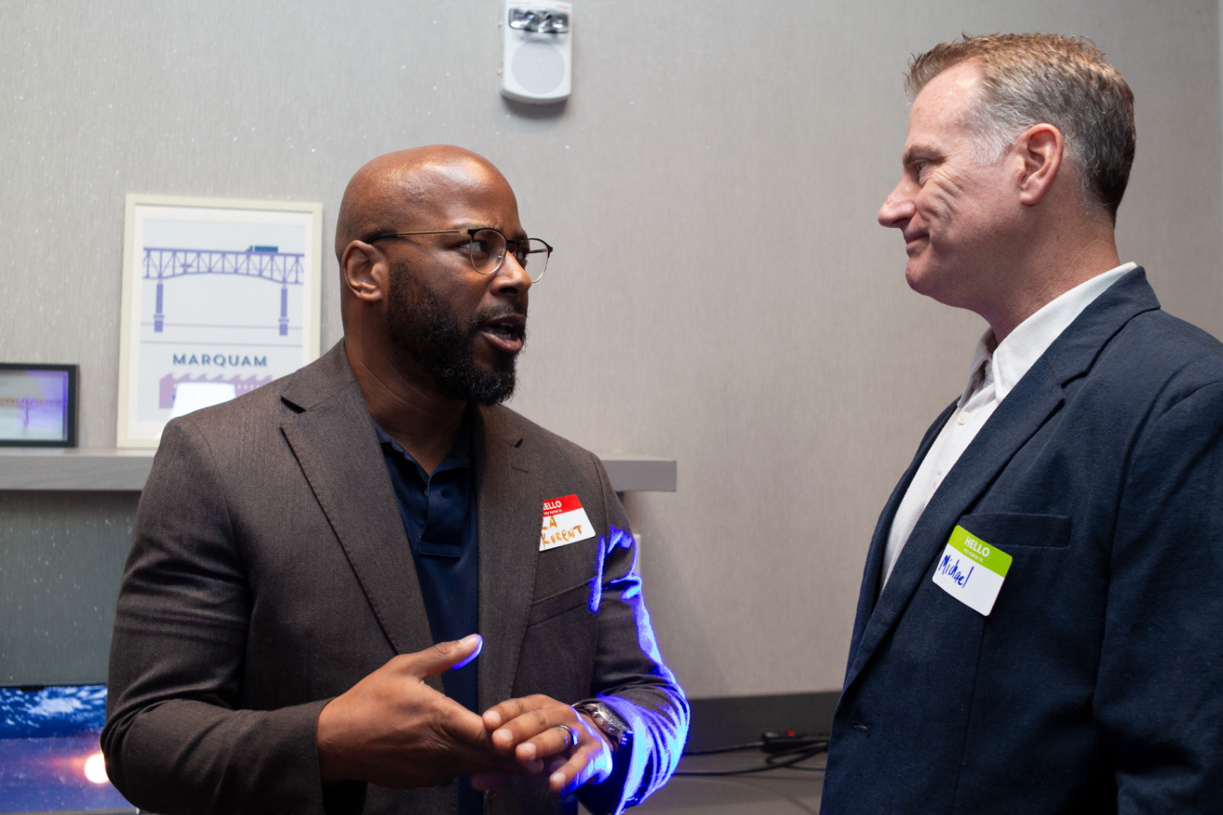 Two attendees in conversation during networking