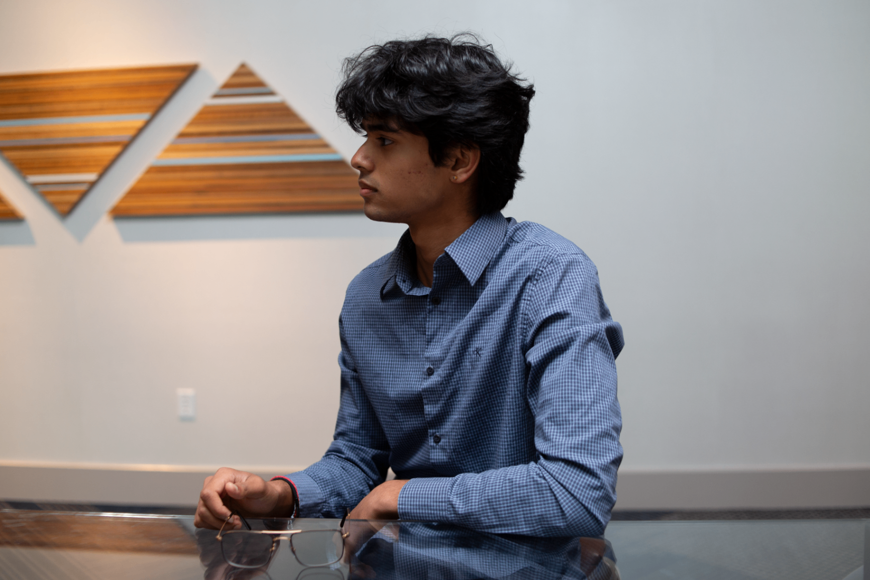 Young attendee listening closely during a discussion