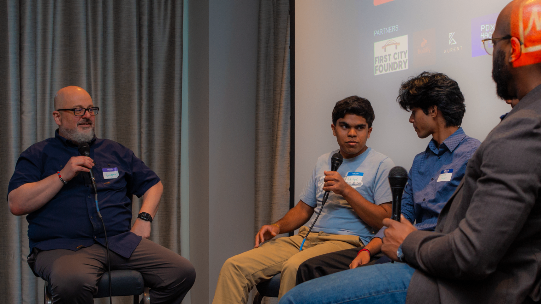 Founder speaking into a microphone during the panel