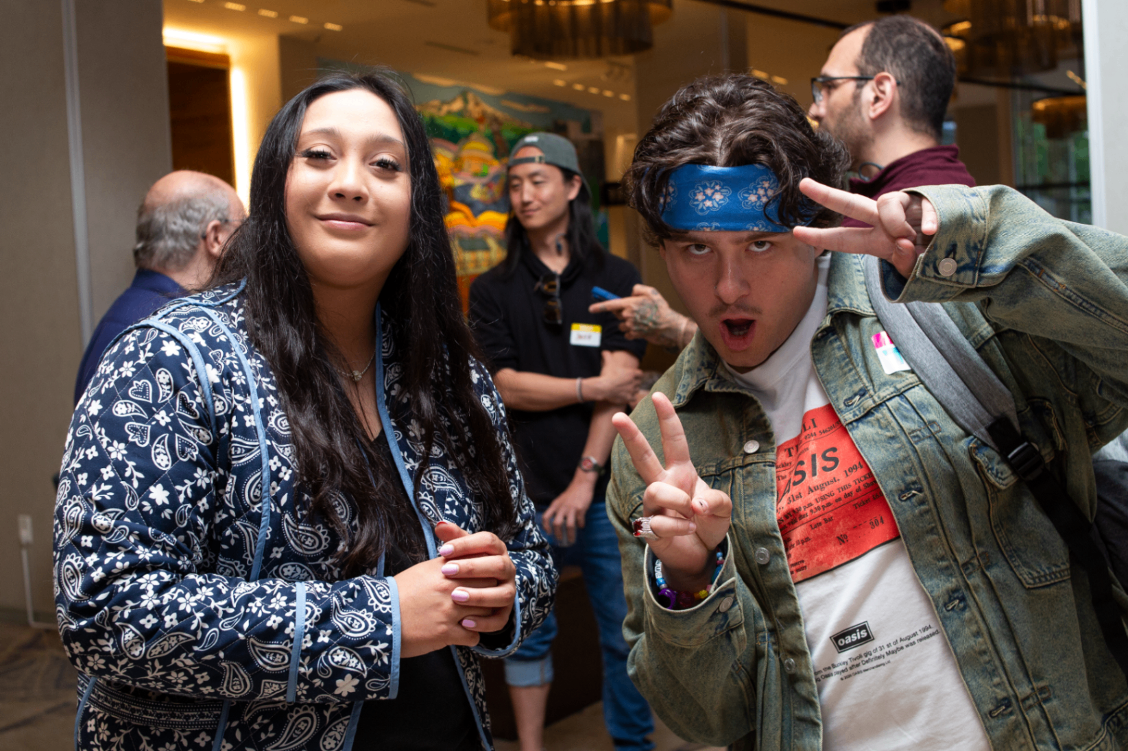Two younger attendees posing playfully for the camera
