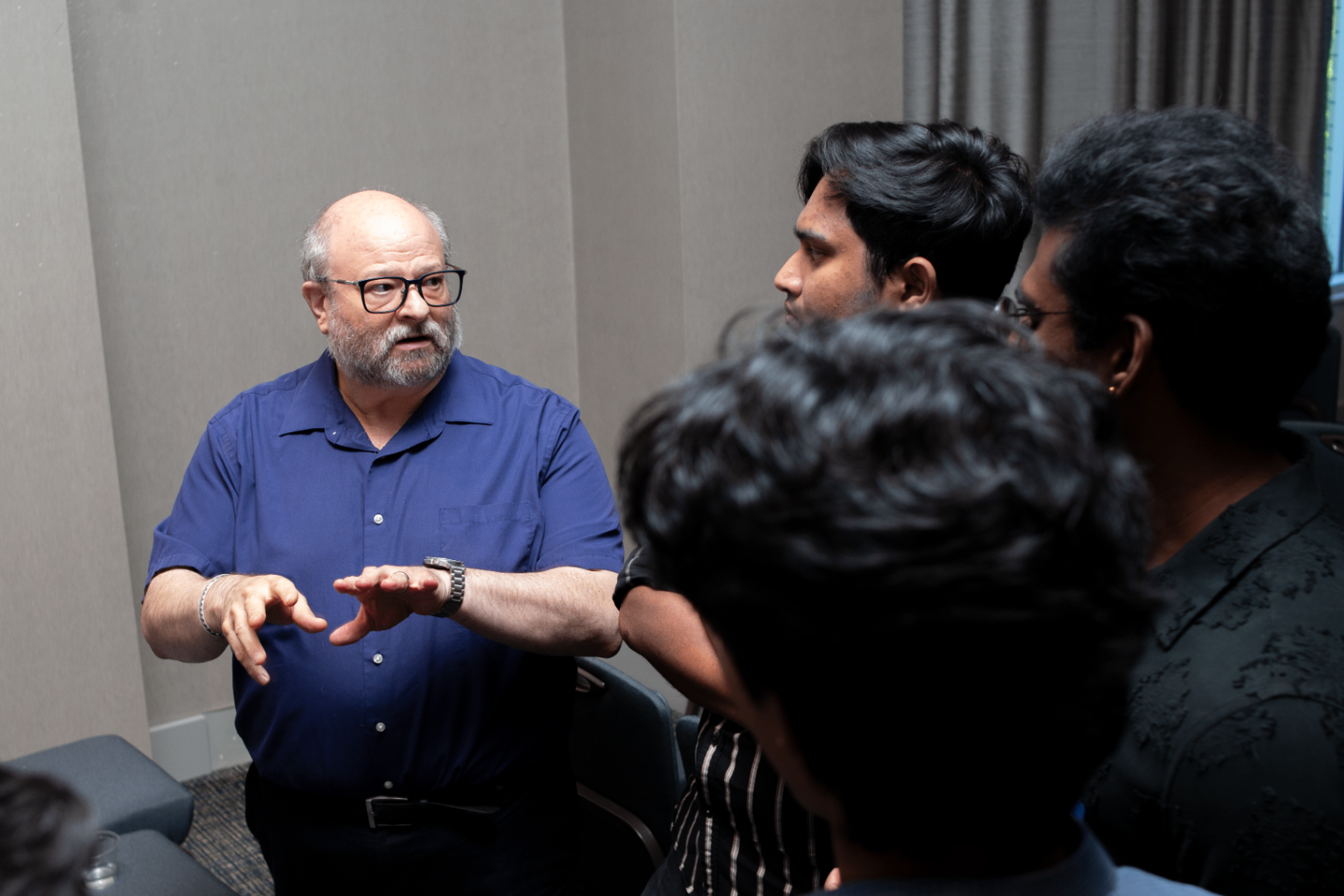 Speaker chatting with attendees in a side conversation