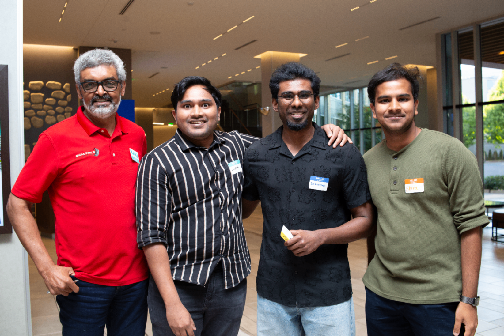 Group portrait of attendees smiling together